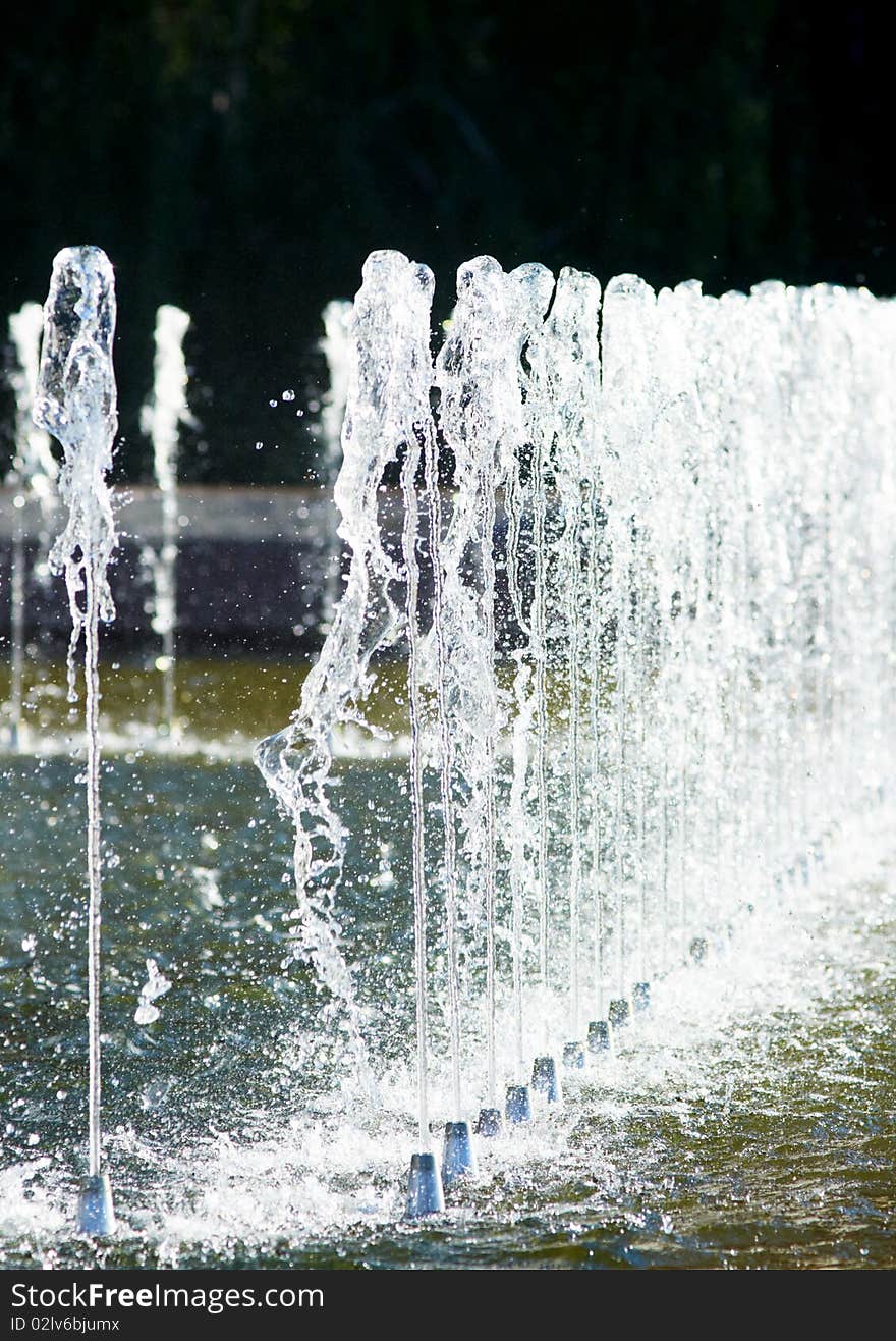 A park fountain, water fall