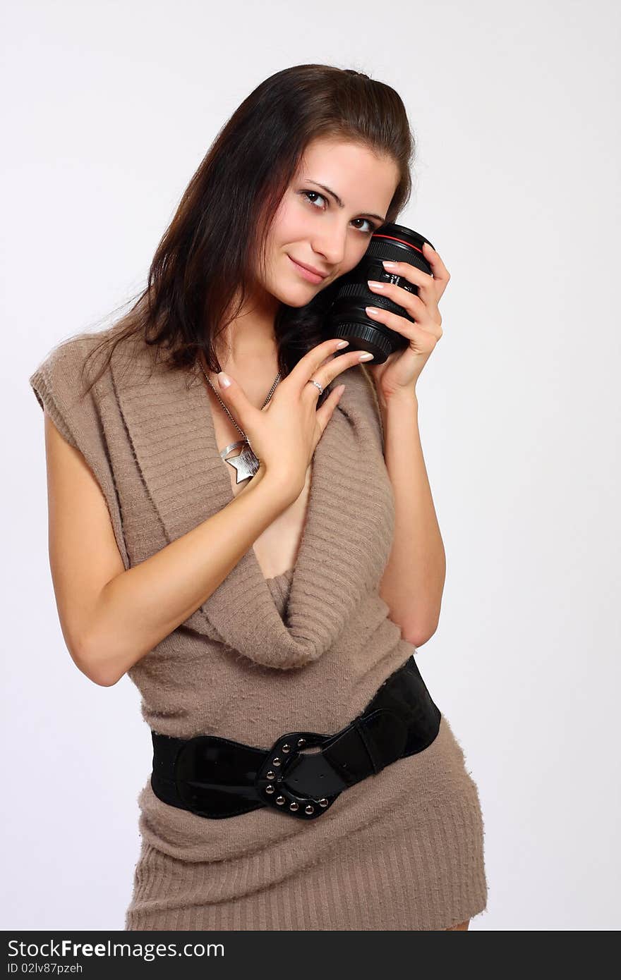 Young sexy woman holding an objective. Young sexy woman holding an objective