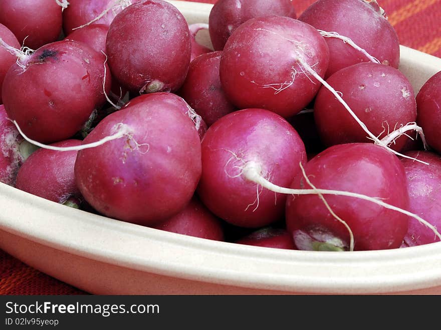 Bowl of radishes on a kitchen table