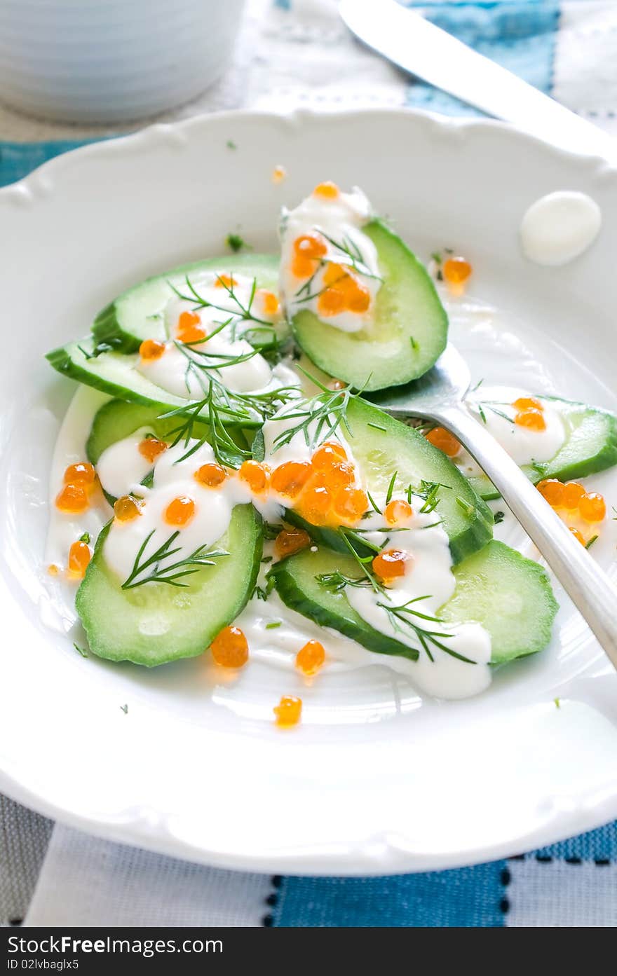 Appetizer from cucumber, caviar and sour cream
