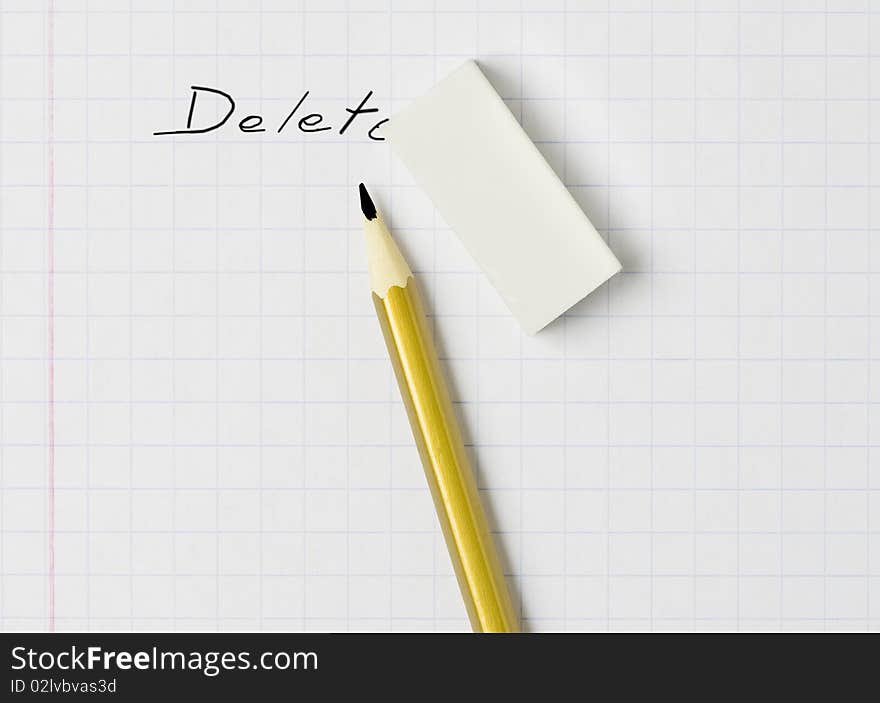 A pencil, an eraser and the word  delete