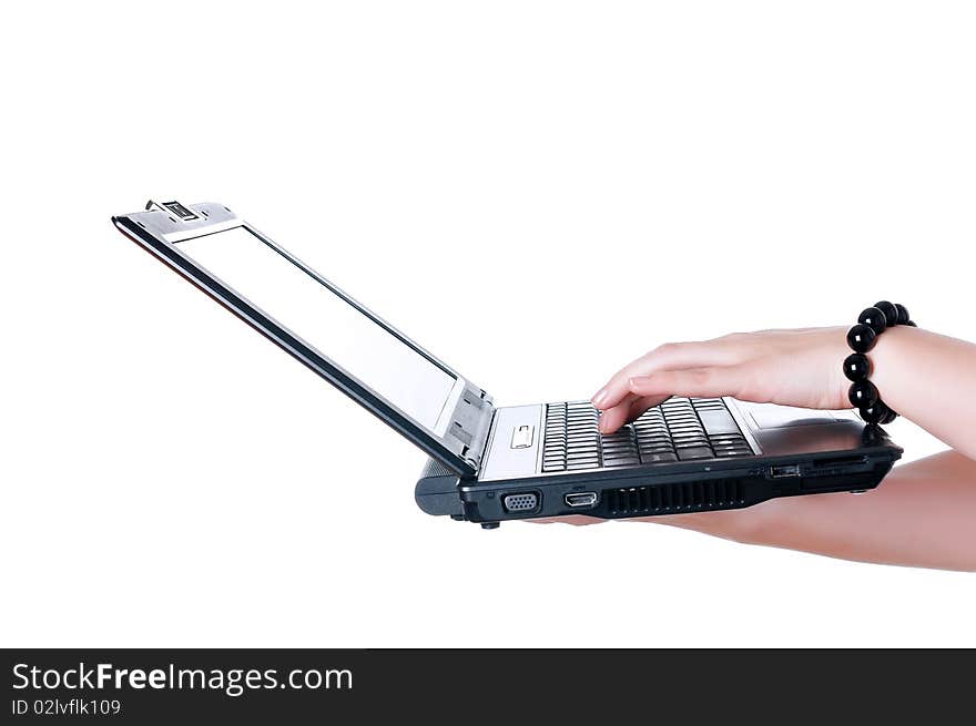 Hands of a young girl working on laptop