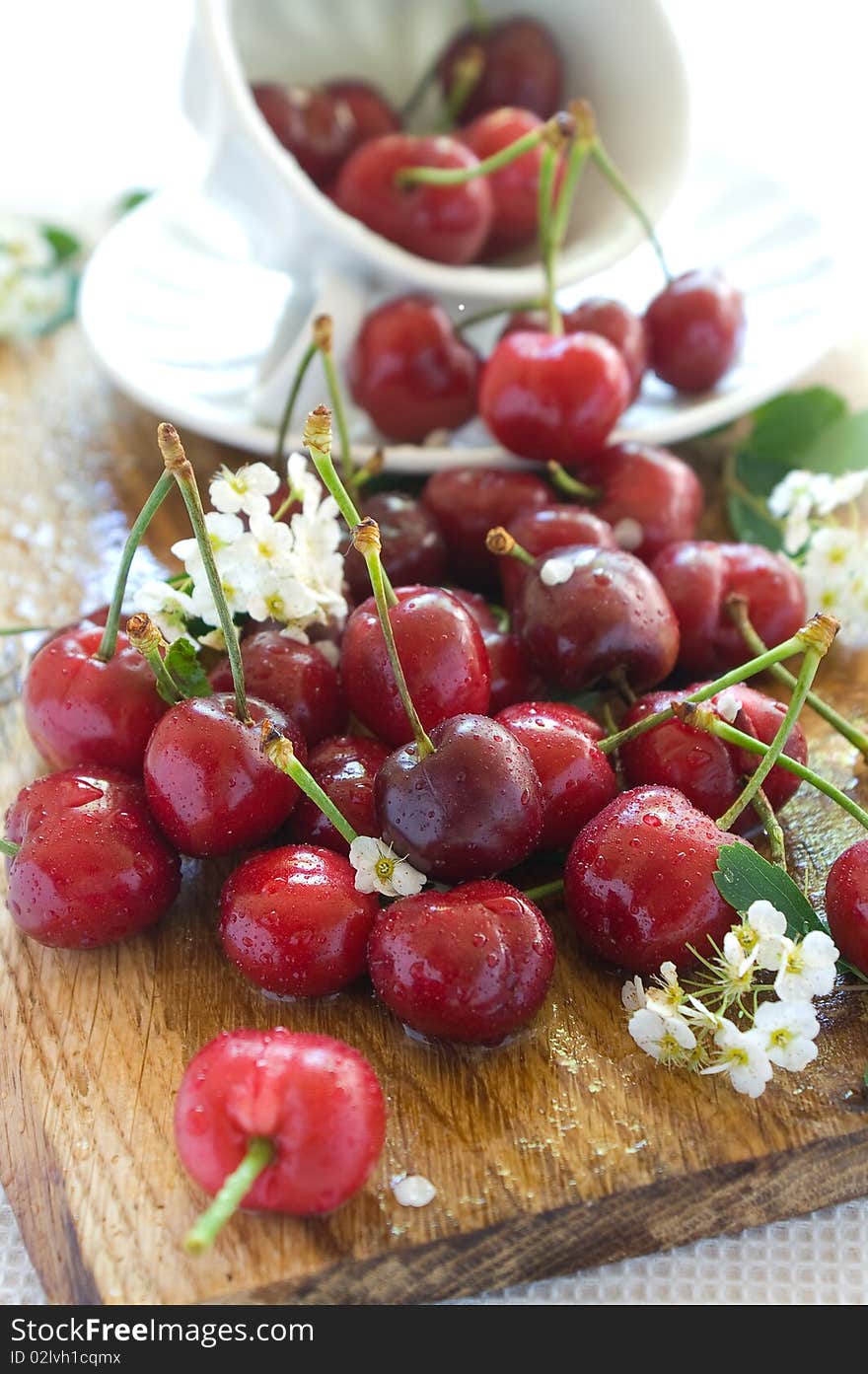 Beautiful  fresh cherry in a board with white cup