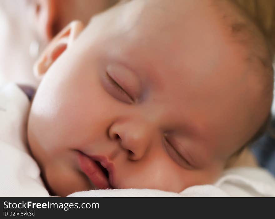 Beautiful young baby boy sleeping. Beautiful young baby boy sleeping