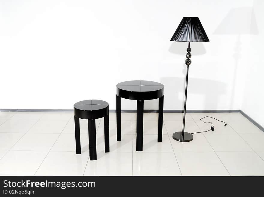 Black Chair, Table And Floor Lamp