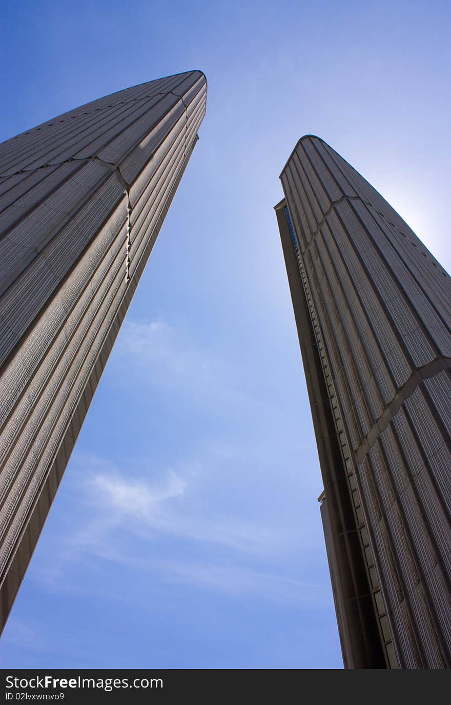 Two highrises on sky background