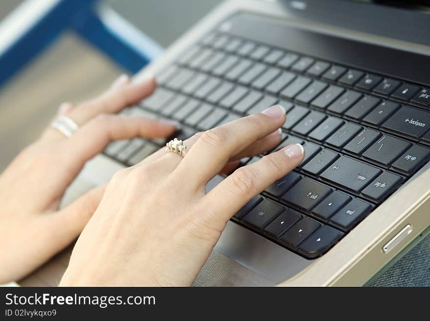 Close up of a hand typing on laptop keyboard. Close up of a hand typing on laptop keyboard