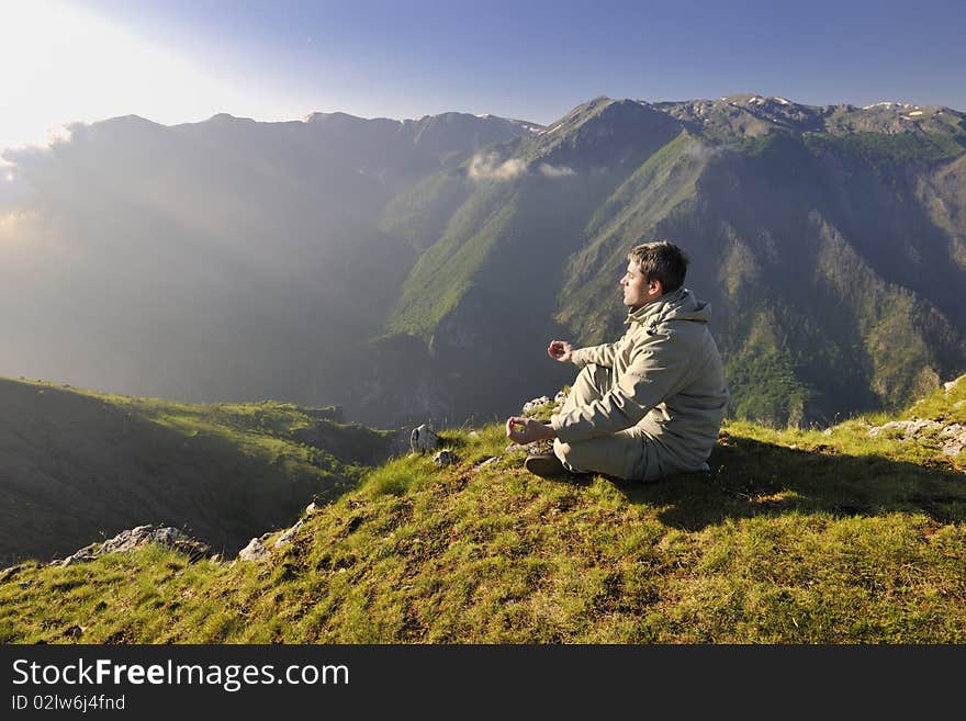 Healthy young man practice youga in height mountain at early morning and sunrise. Healthy young man practice youga in height mountain at early morning and sunrise