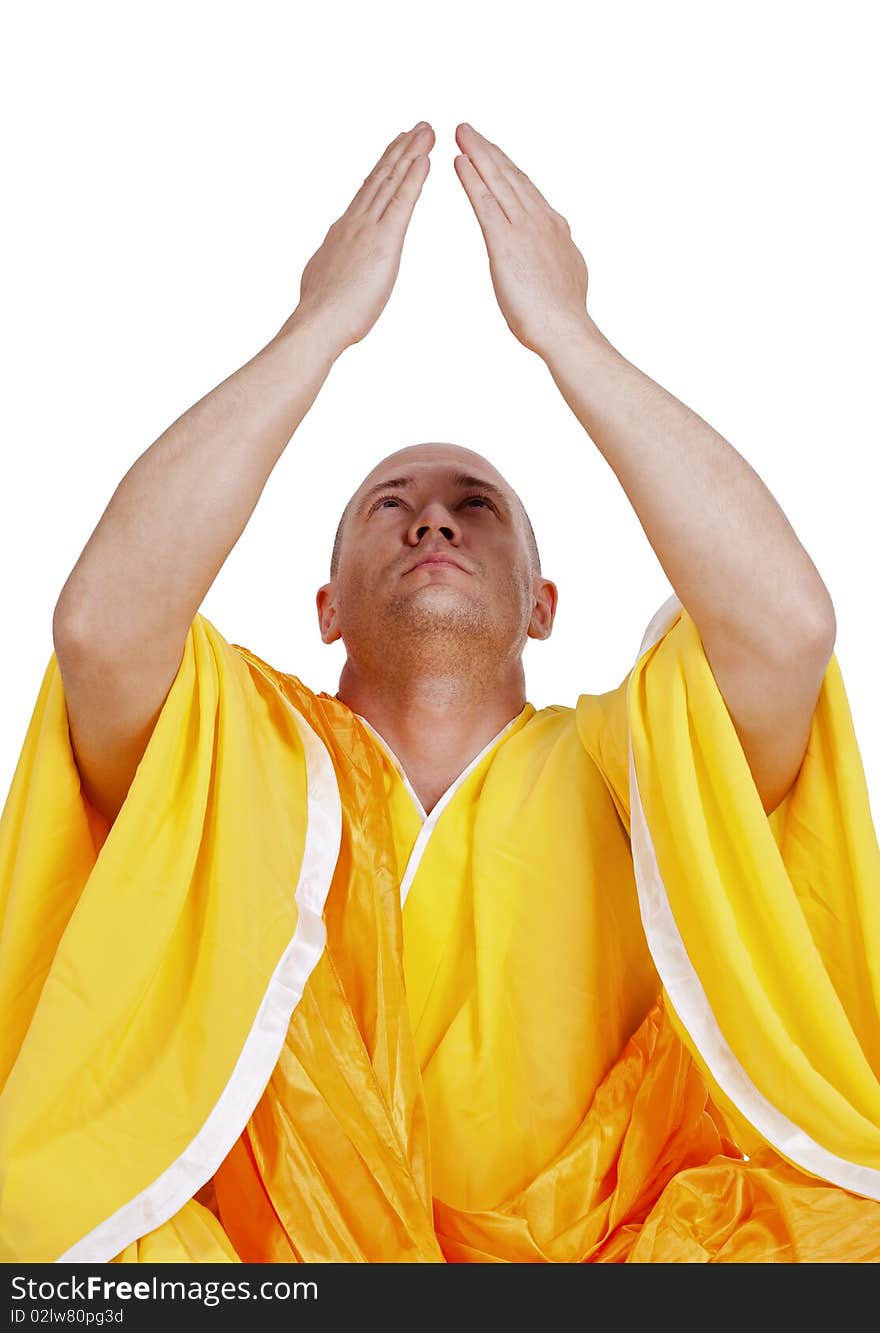 Young praying Buddhist monks. Isolated on white background