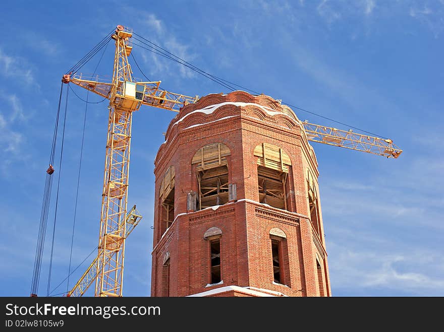 High-altitude tower crane necessary for elevation cargo and architectural construction  by erection new-built building