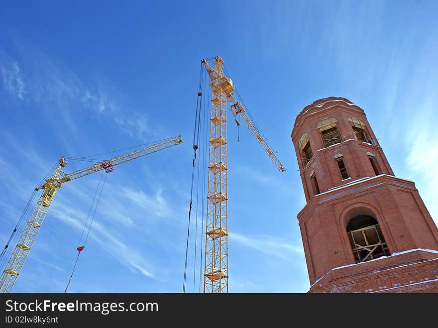 High-altitude tower crane necessary for elevation cargo and architectural construction  by erection new-built building