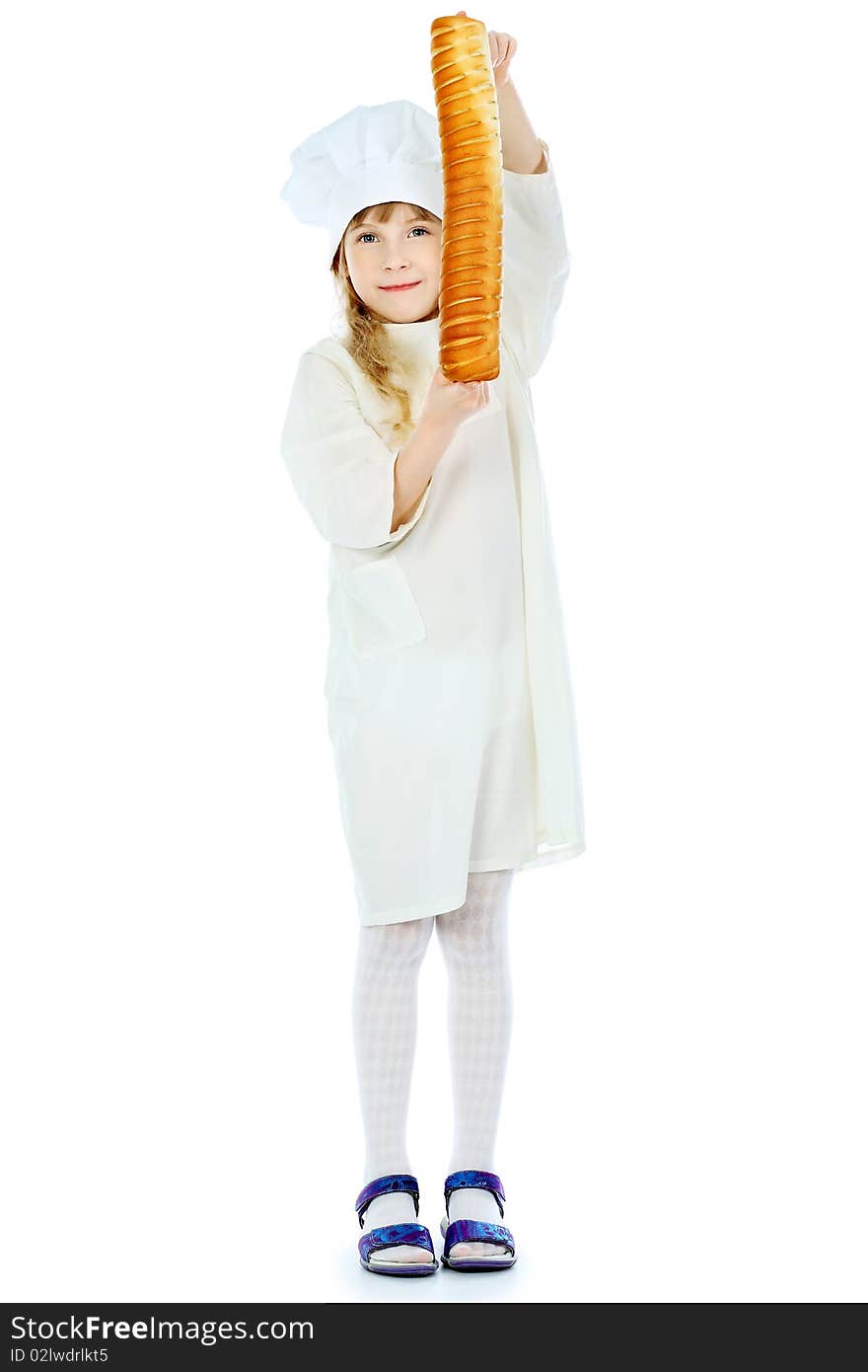 Shot of a little kitchen girl in a white uniform. Isolated over white background. Shot of a little kitchen girl in a white uniform. Isolated over white background.