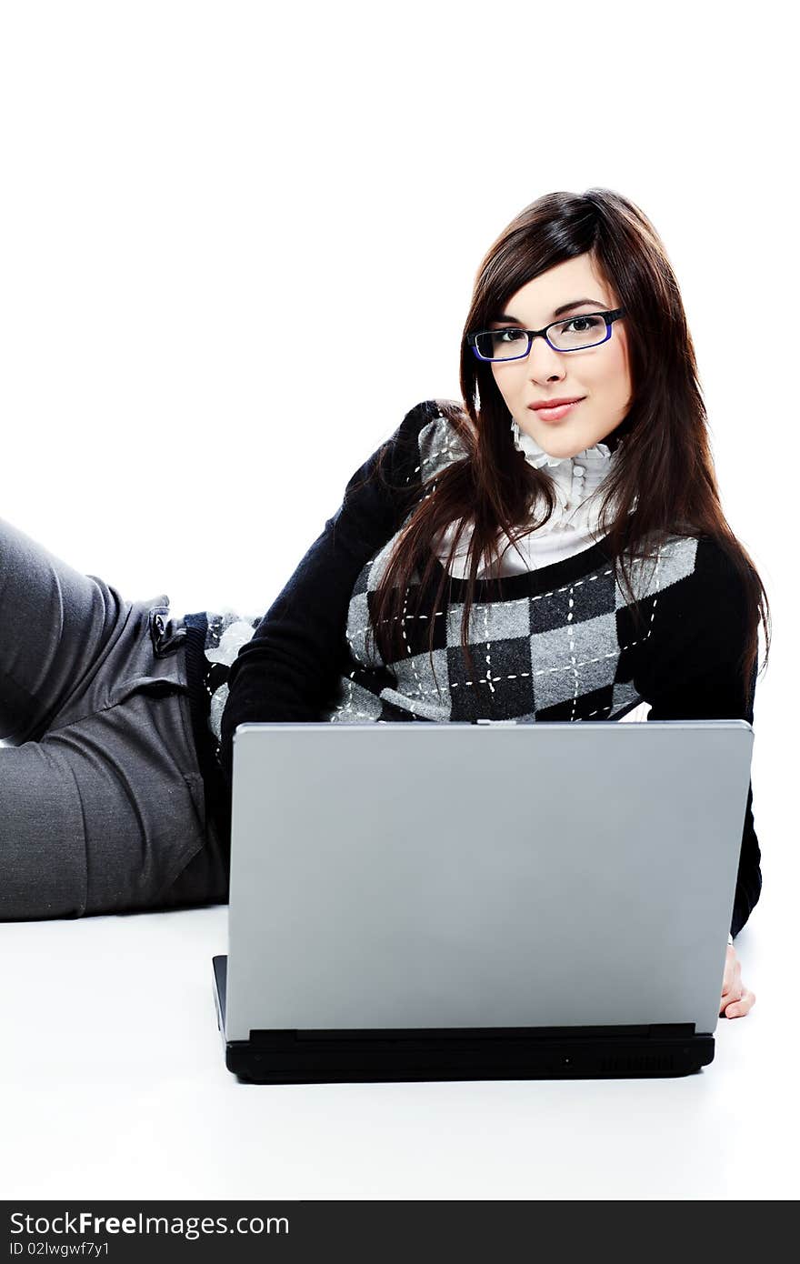 Portrait of a beautiful young woman in a business suit  with a laptop. Isolated over white background. Portrait of a beautiful young woman in a business suit  with a laptop. Isolated over white background