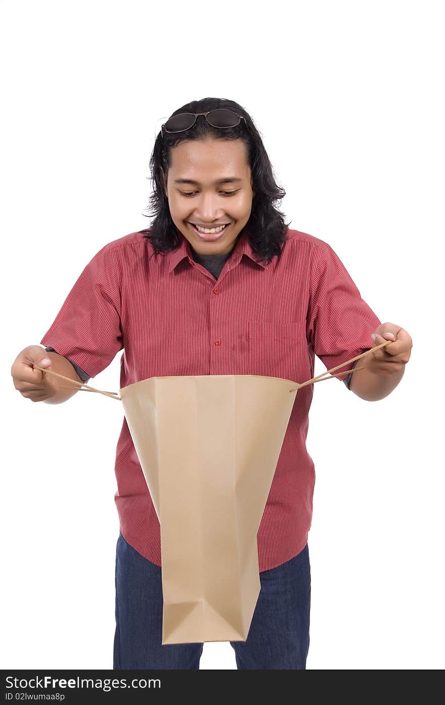 Long hair man with paper bag isolated on white background