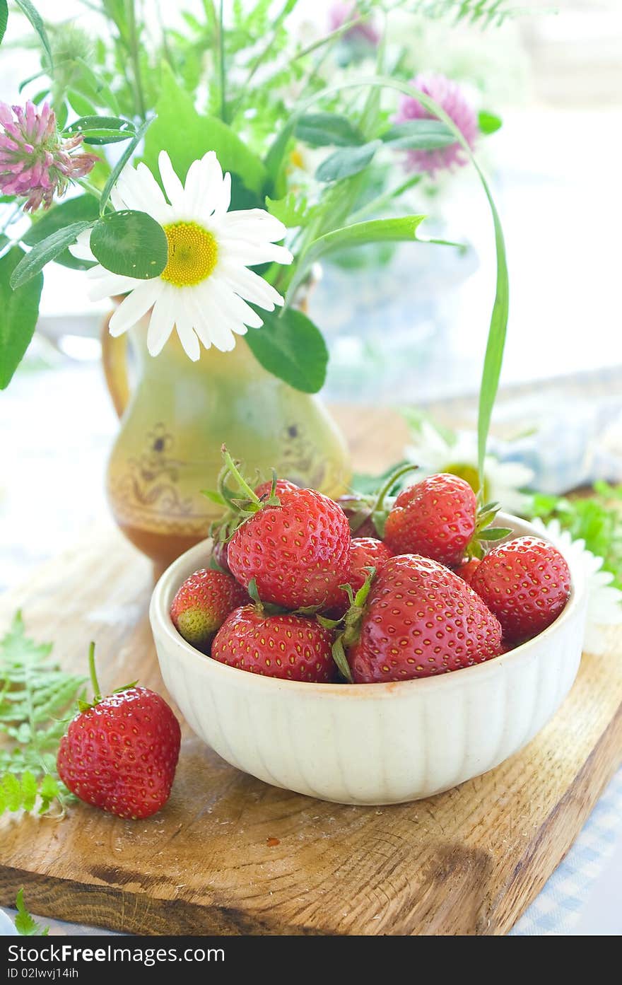 Fresh strawberries in a ceramic  bowl