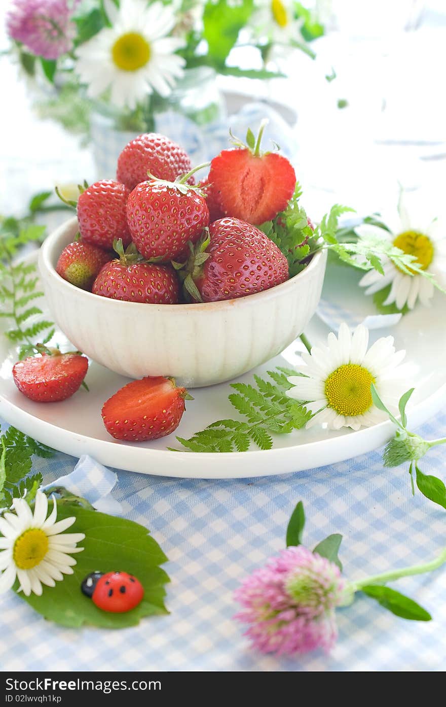 Fresh strawberries in ceramic bowl