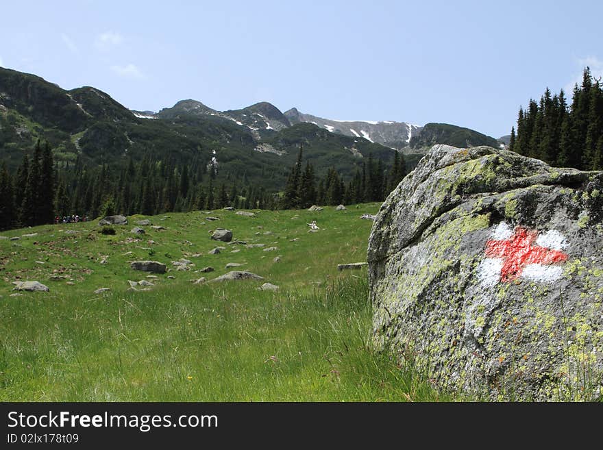 Sign on a rock , towards the mountain peak, in Parang mountains, Romania