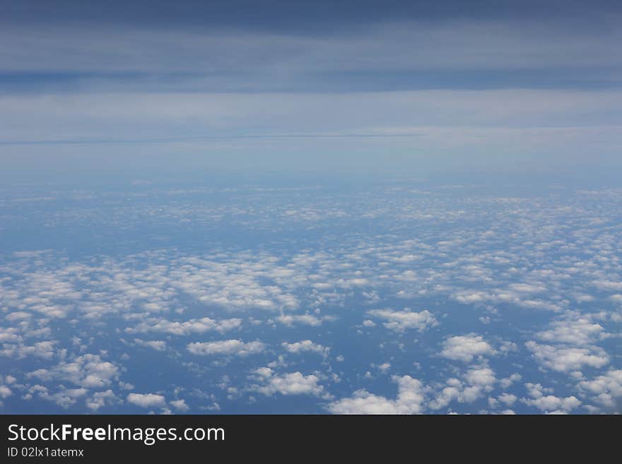 Airplane view above the clouds. Airplane view above the clouds