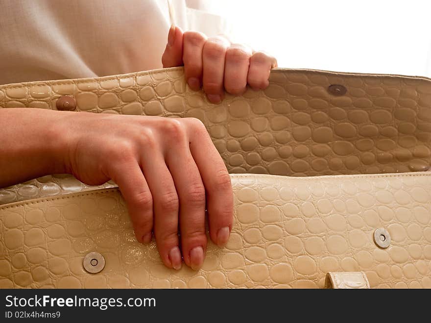 White women bag in hand. Isolated on white background. White women bag in hand. Isolated on white background