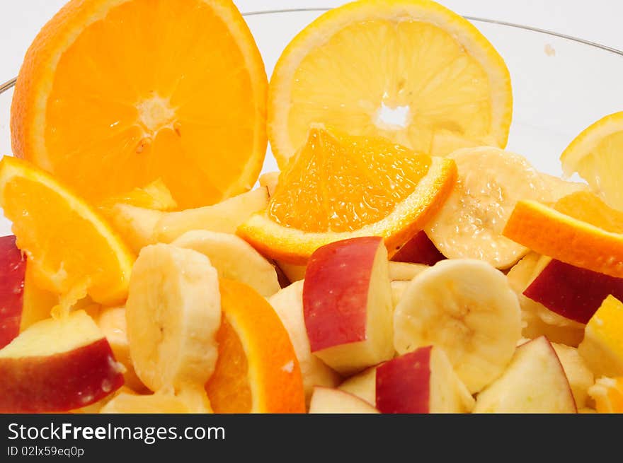 Cut fruit in a glass bowl. Cut fruit in a glass bowl