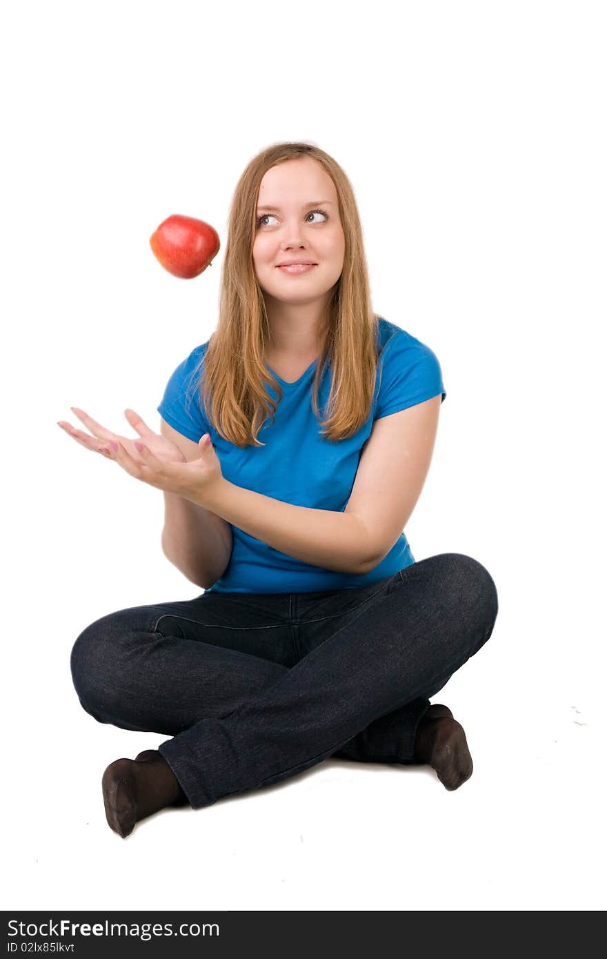 Beautiful girl throws up a red apple, isolated on white. Beautiful girl throws up a red apple, isolated on white