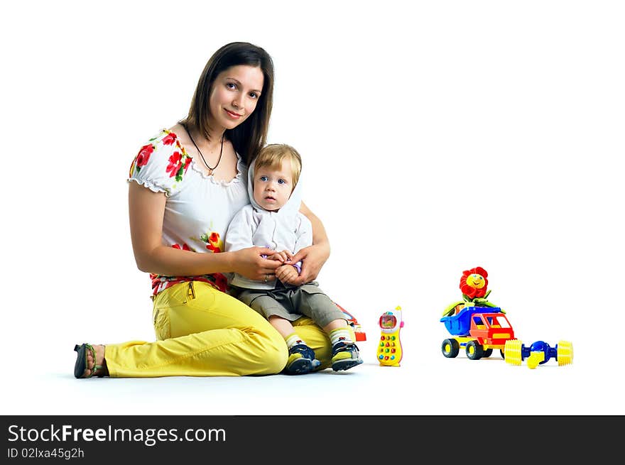 The portrait of a little boy and his mother playing with toys