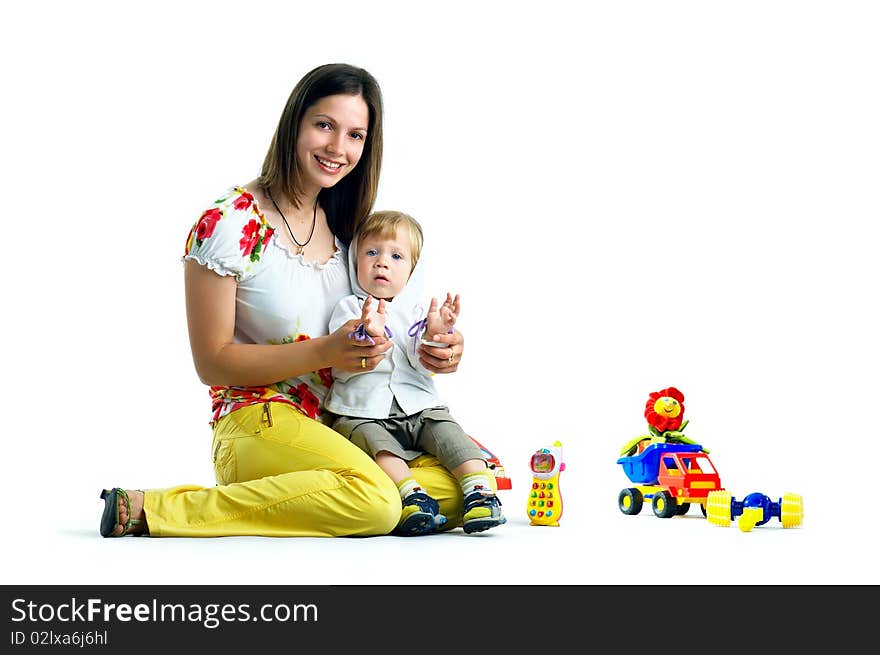 The portrait of a little boy and his mother playing with toys