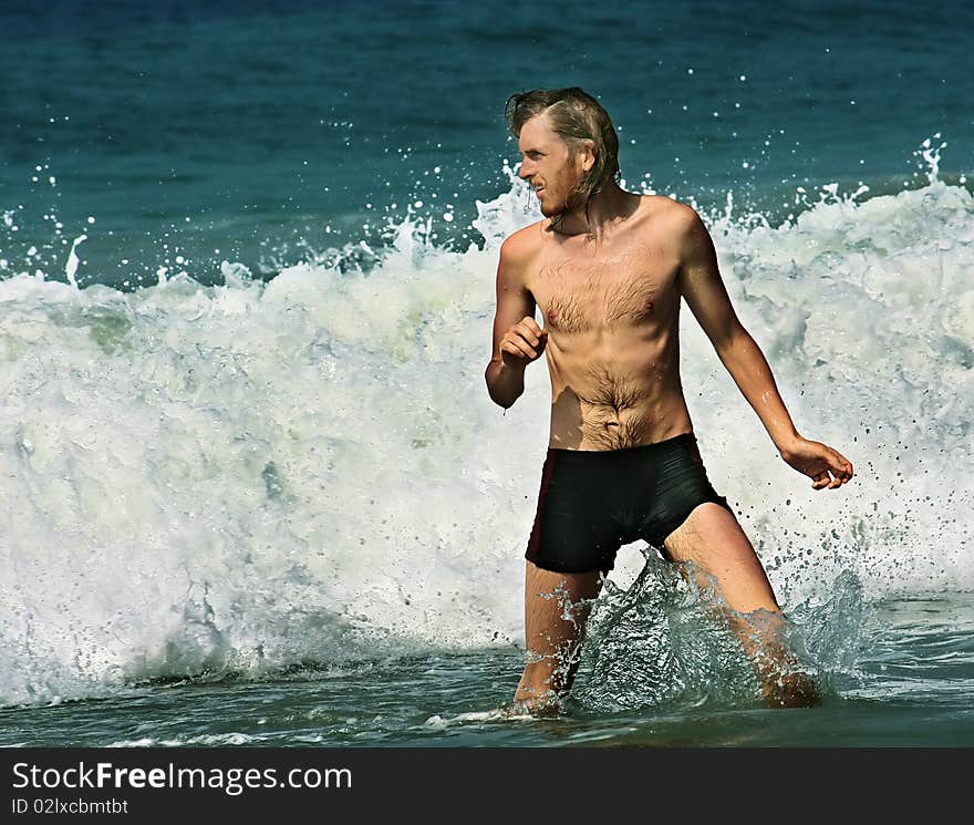 Man relaxes on the sea after work in the office