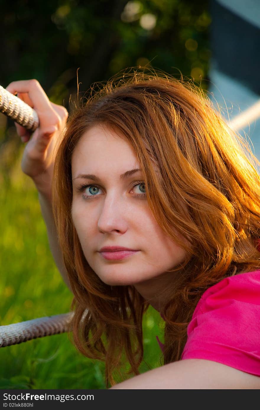 Redhead woman portrait at roadside sunset. Redhead woman portrait at roadside sunset