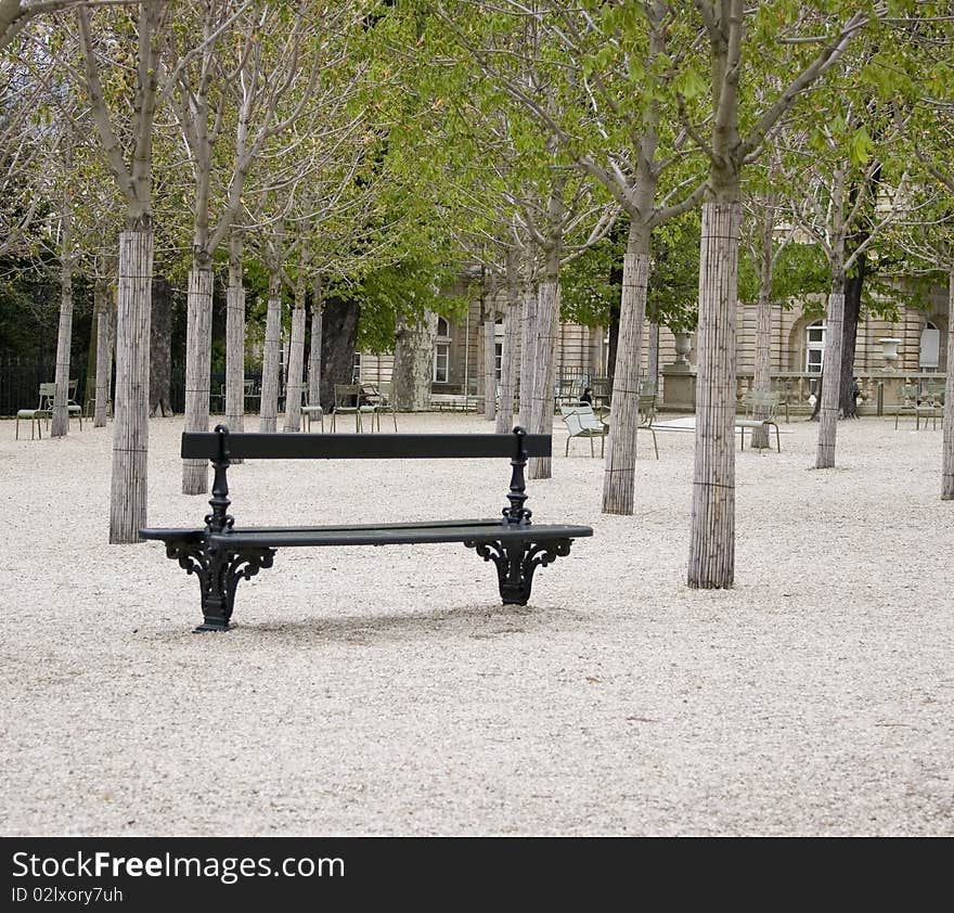 A bench in the Jardin du Luxembourg in Paris, France. A bench in the Jardin du Luxembourg in Paris, France