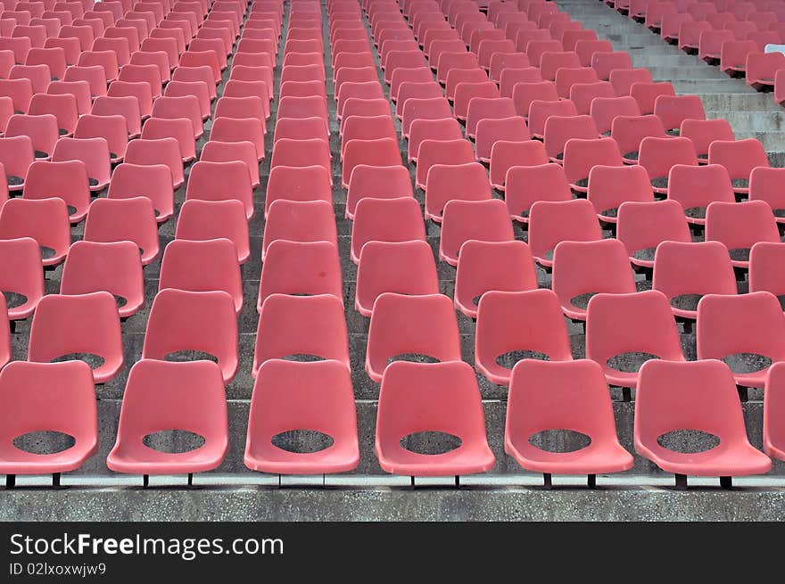 Many Empty Seats In Rows In An Outdoor Stadium. Many Empty Seats In Rows In An Outdoor Stadium