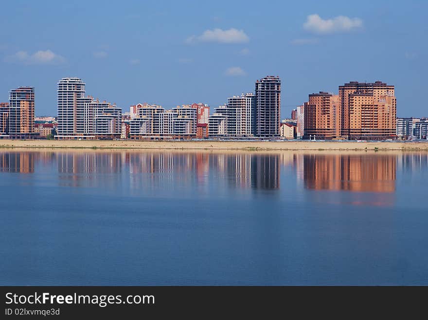 New buildings on the river embankment.