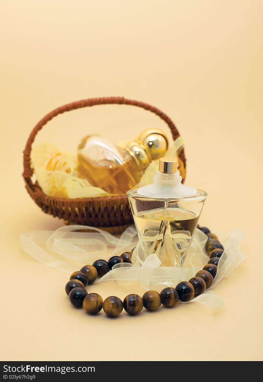 Perfumes and beads. Perfume in a basket