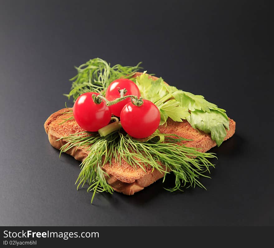 Dill and tomatoes on toast - closeup