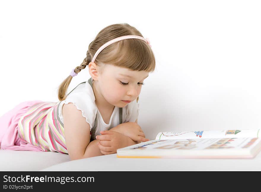 Little girl reading book