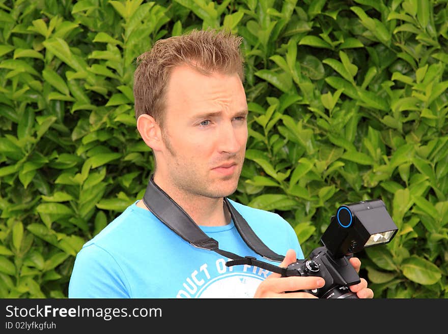 Puzzled Young Photographer