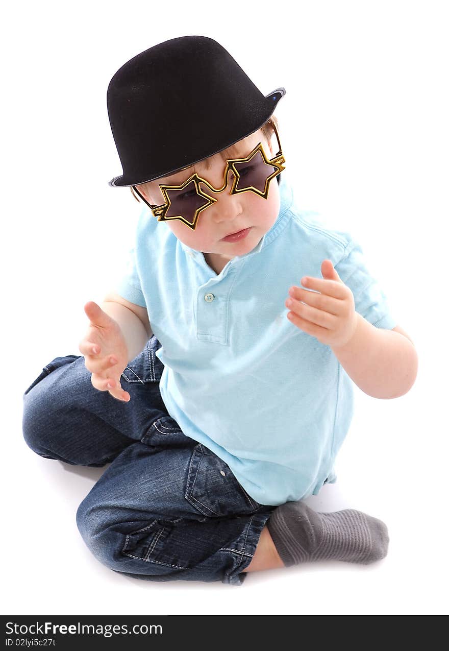 Young boy with bowler hat and novelty hat. Young boy with bowler hat and novelty hat