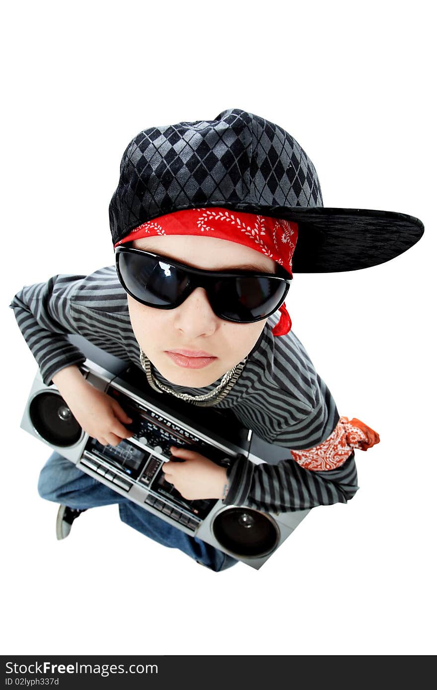 Shot of a trendy teenager listening to music in headphones. Isolated over white background. Shot of a trendy teenager listening to music in headphones. Isolated over white background.