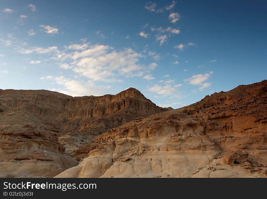 Rocky desert landscape at sunset in Negev, Israel