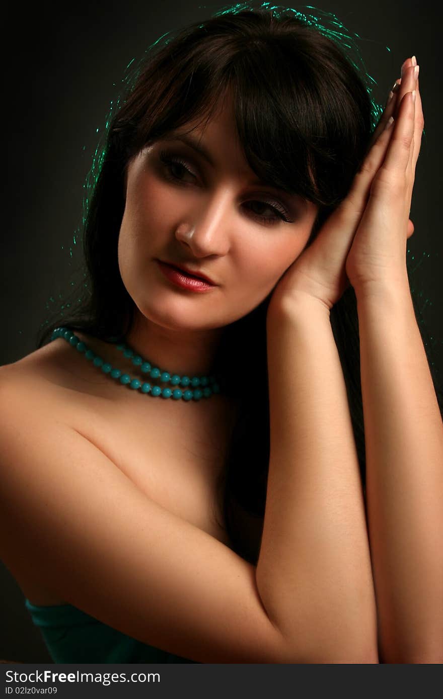 Beautiful young woman on dark background. Beautiful young woman on dark background