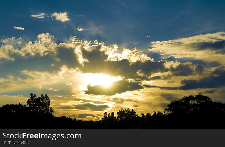 Dramatic sunset over the woods.