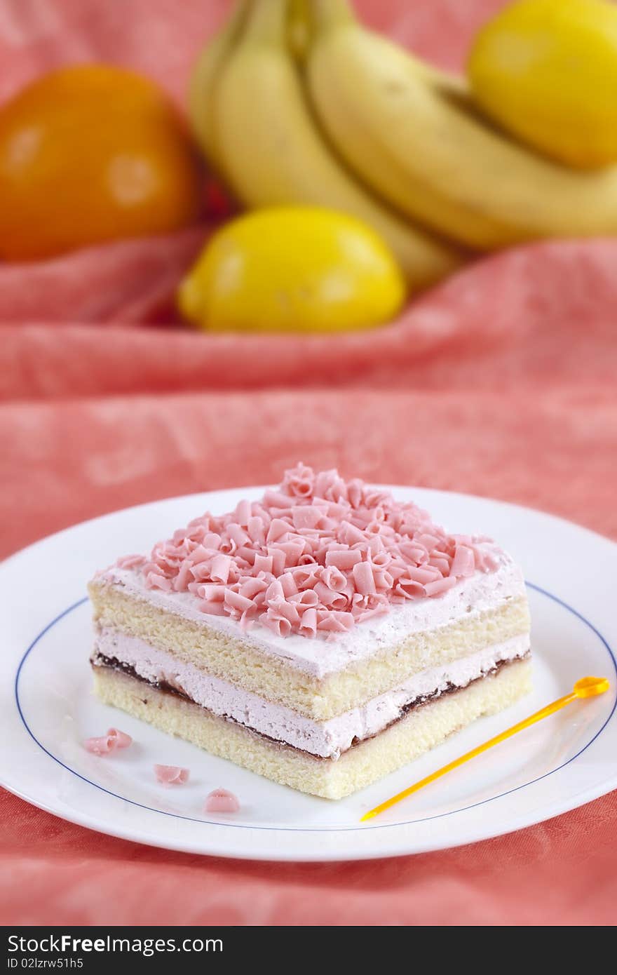 Close up of sweet cake with some fruits on the background