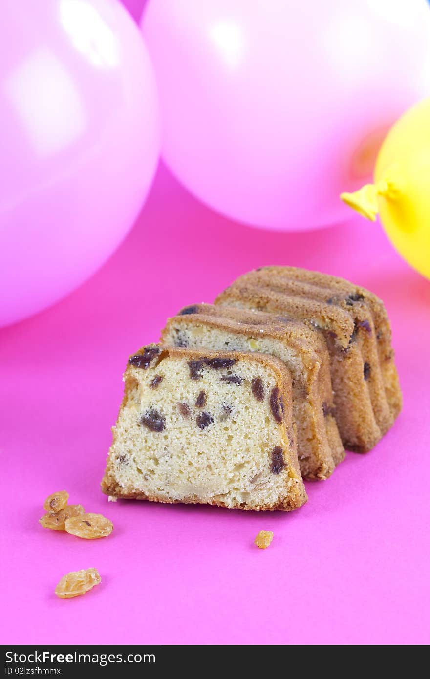 Slice sweet cake on pink table top