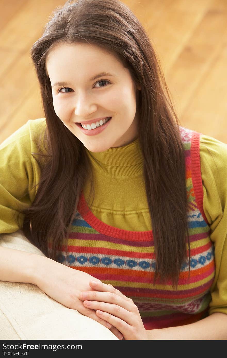 Woman Relaxing On Sofa At Home