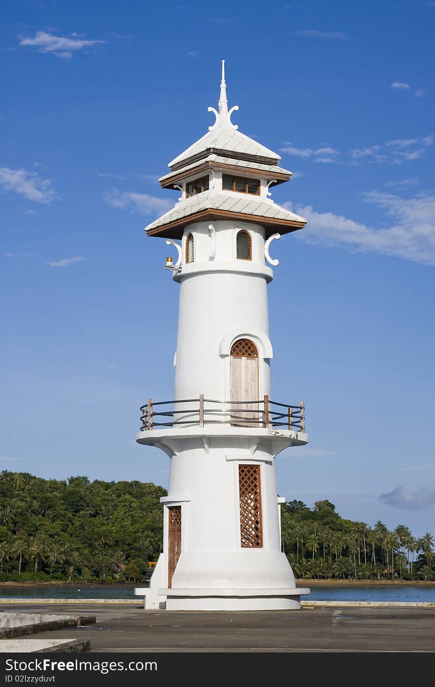 White lighthouse in bay on Koh Chang island, Thailand