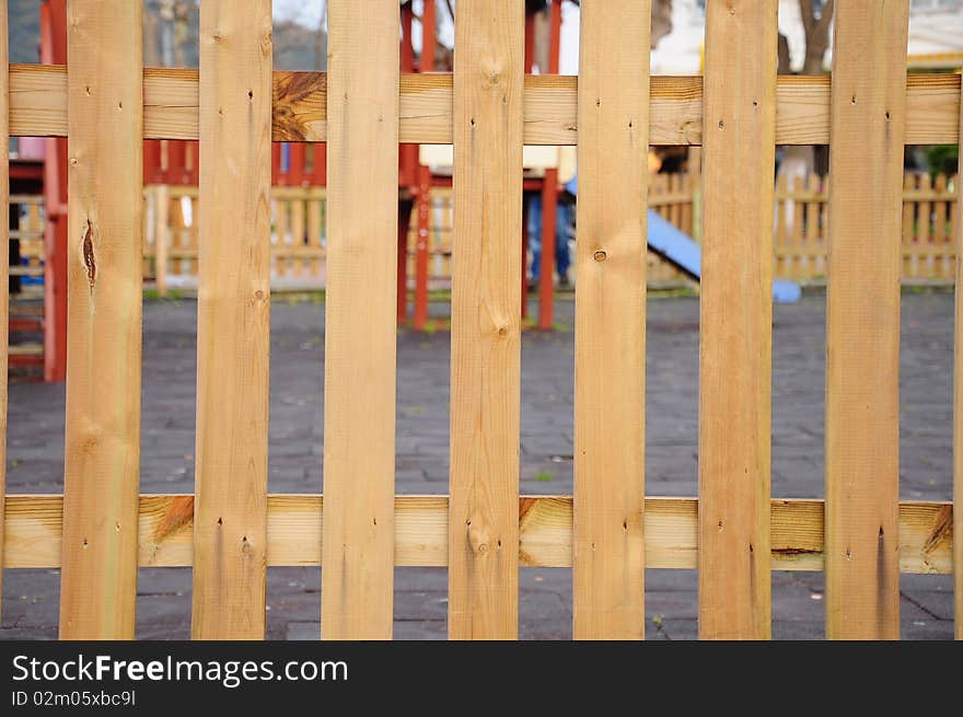 Wooden fence surrounding play ground