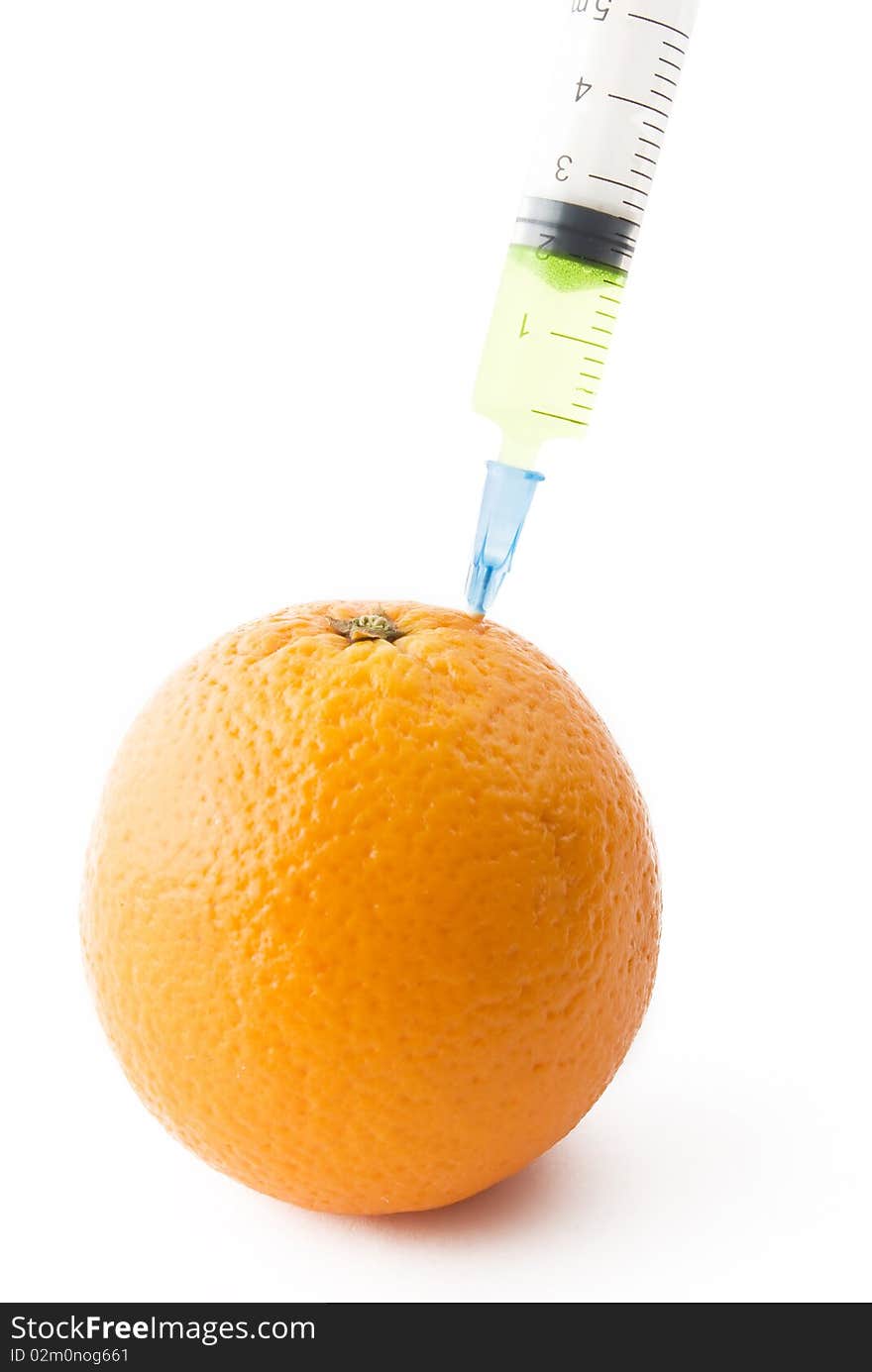 Juicy Orange with medical syringe over white