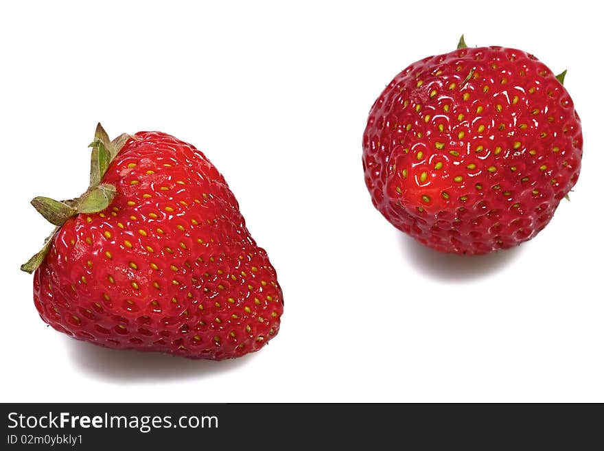 Two strawberries on white background