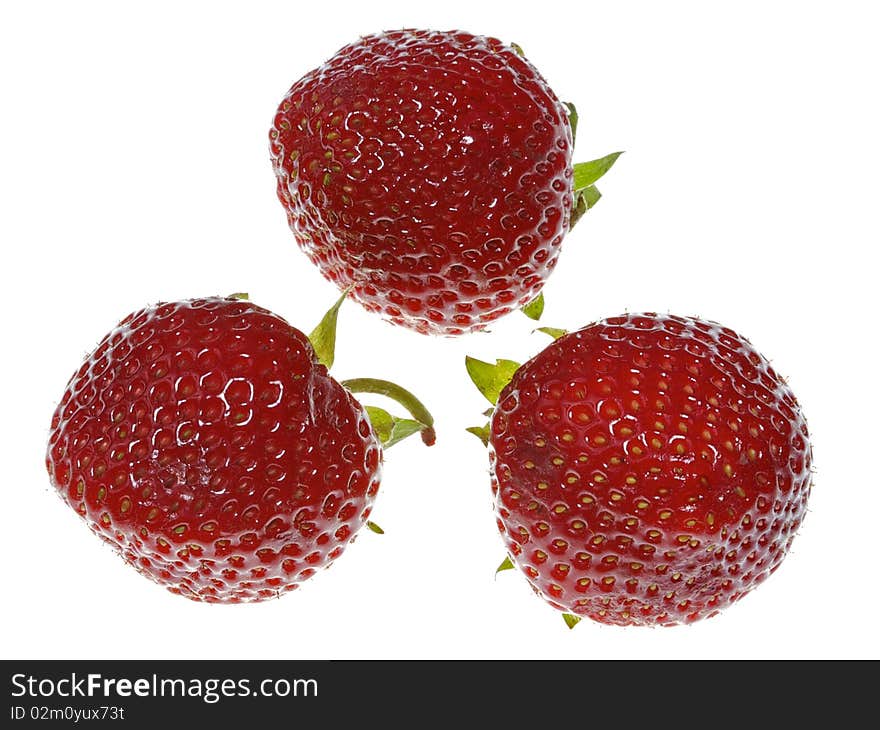 Three strawberries on white background