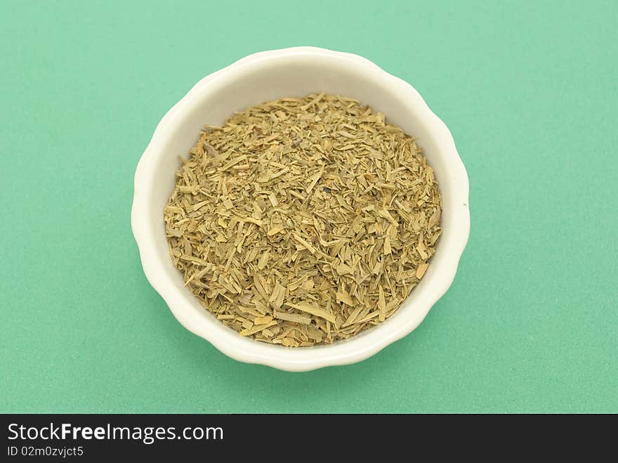 Dried tarragon macro photography close-green background